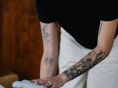 Modern athletic wear folded neatly on a wooden bench